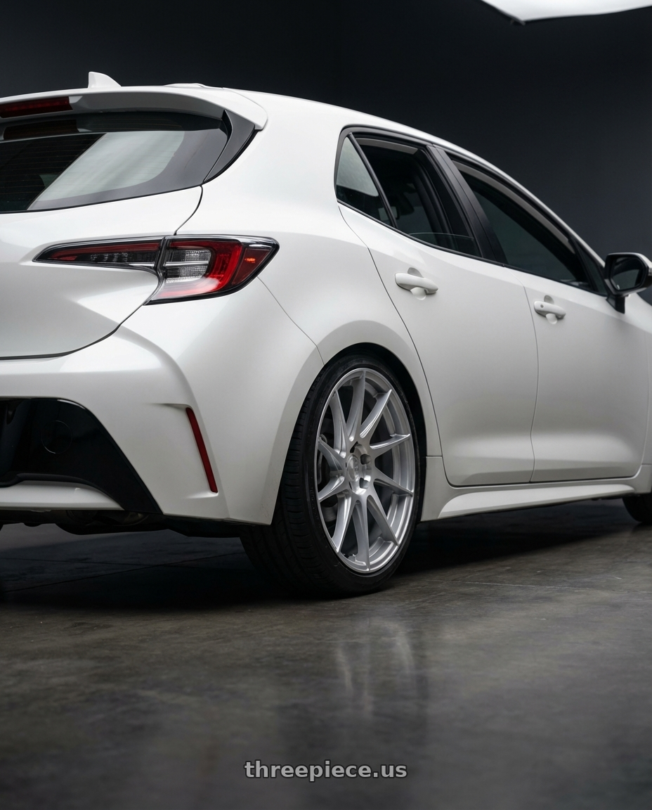 2023 Toyota Corolla Hatchback with Aodhan AH09 5x114.3 18x8.5 +35 Gloss Silver Machined Face wheels rear three quarter view square tires