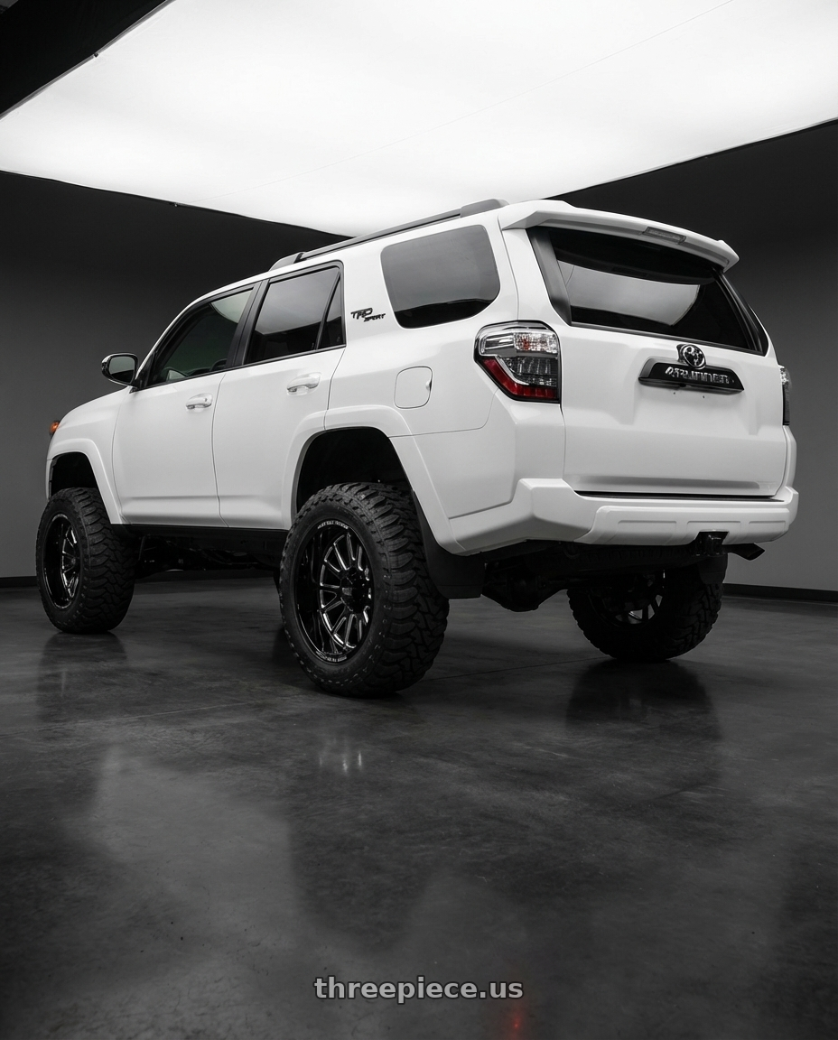 2022 Toyota 4Runner with Moto Metal MO401 6X139.7 20X10 -24 GLOSS BLACK MILLED wheels rear three quarter view meaty tires