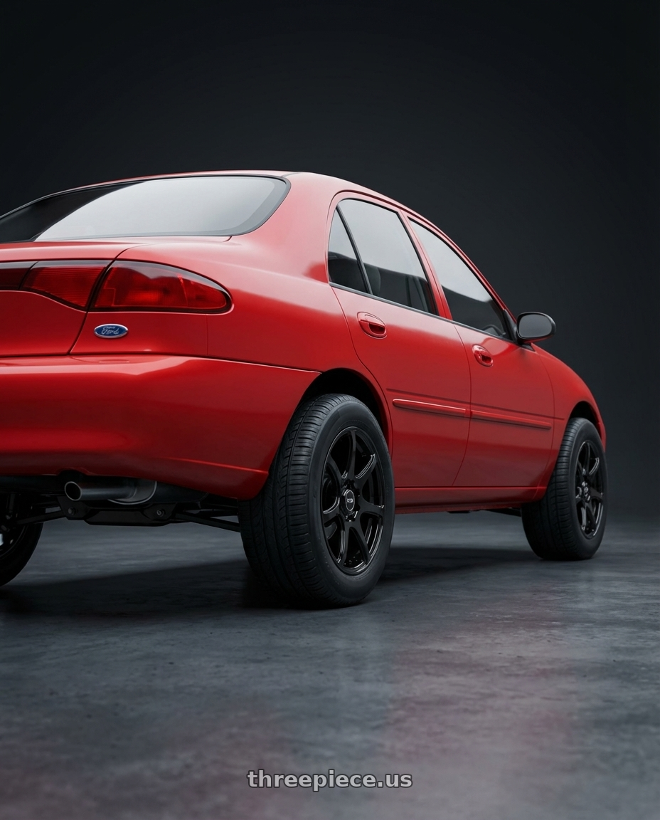 1999 Ford escort with Ns Wheels NS1203 4x100/4x114.3 15x6.5 +38 Gloss Black wheels rear three quarter view meaty tires