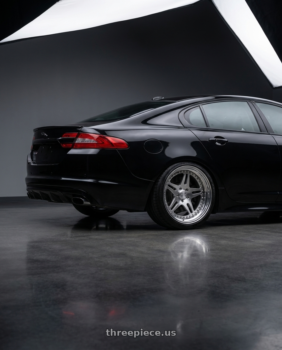 2015 Jaguar XFR-S with CCW SA52 5x108 20x10.5 +62 Polished wheels rear three quarter view square tires