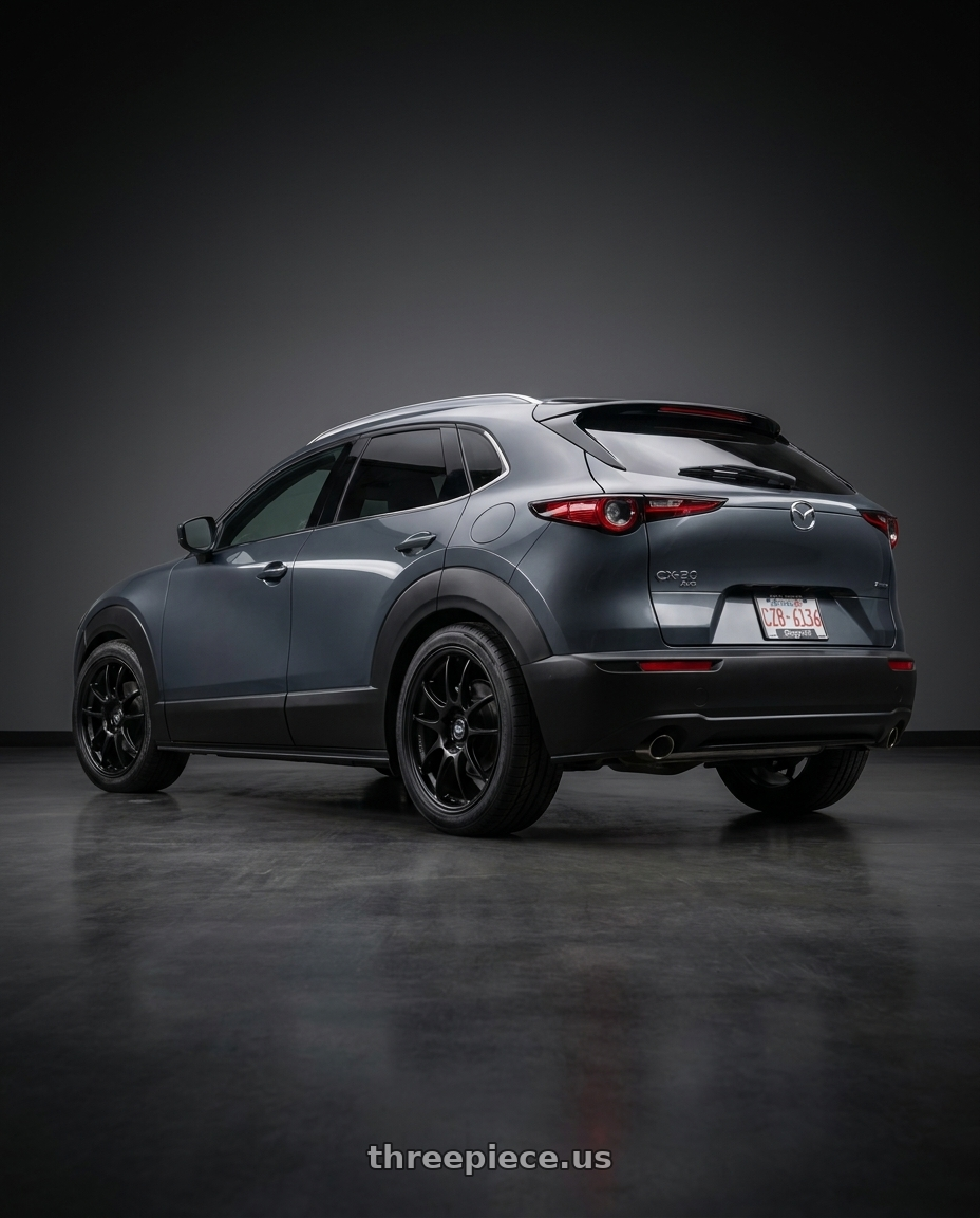 2026 mazda cx30 with Enkei PF01 5x114.3 18x9.5+35 Black wheels rear three quarter view square tires