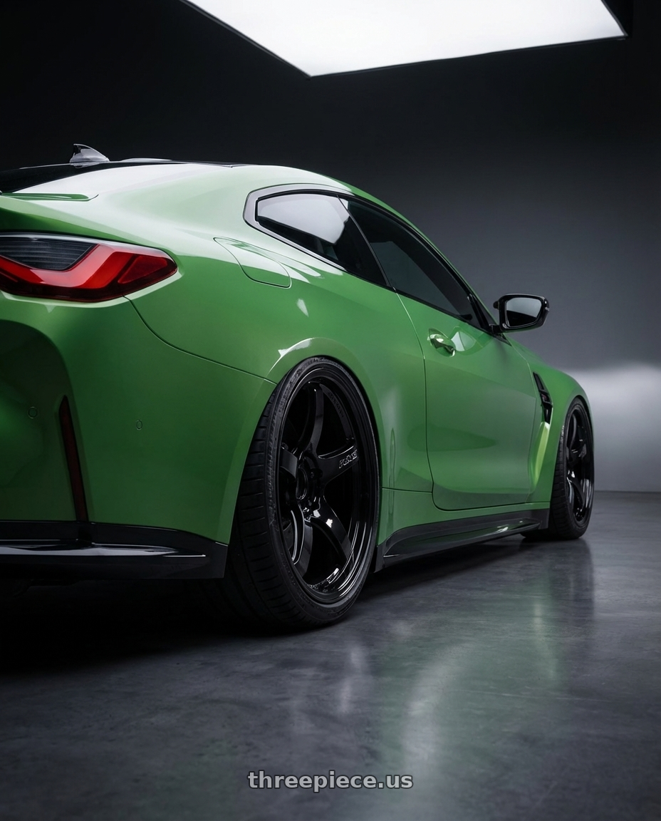 2024 BMW M4 G82 with Gram Lights 57CR 5x112 19x9.5+45 Glossy Black wheels rear three quarter view slight stretch tires