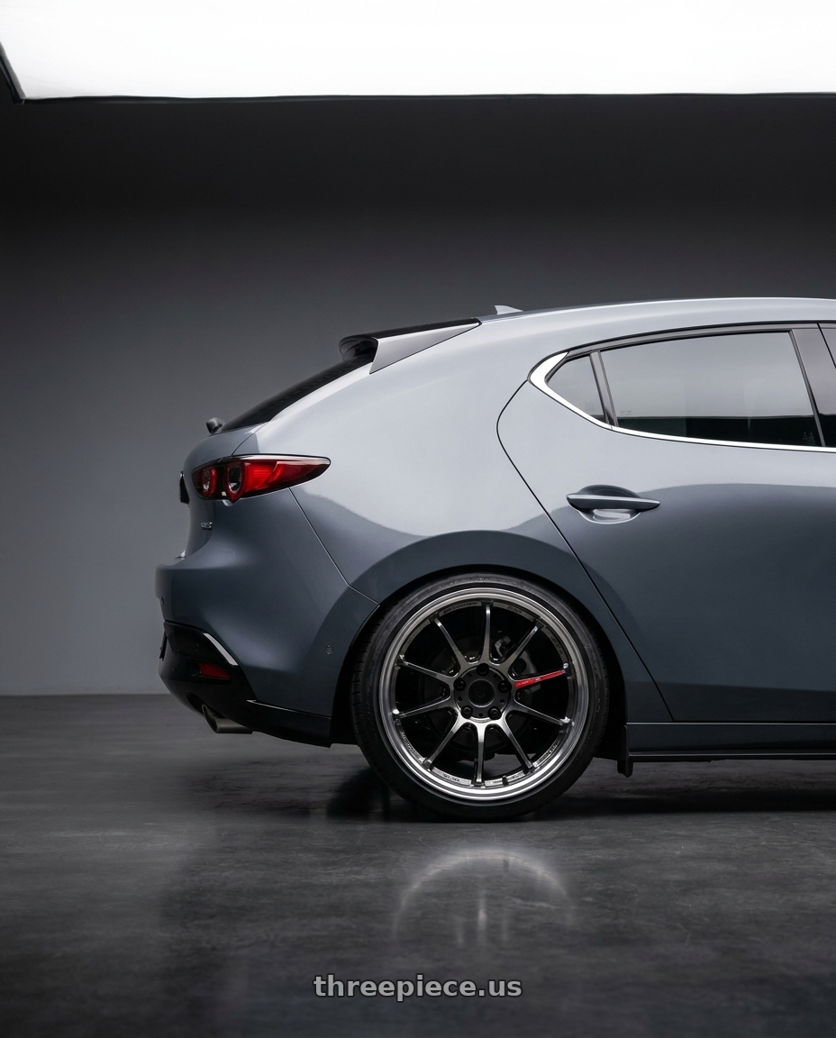 2022 mazda3 5d signature carbon packge Polymetal Grey Metallic with Work Emotion Zr10 5x100 18x10.5 +12 Glim Black Diamond Rim cut wheels rear three quarter view slight stretch tires