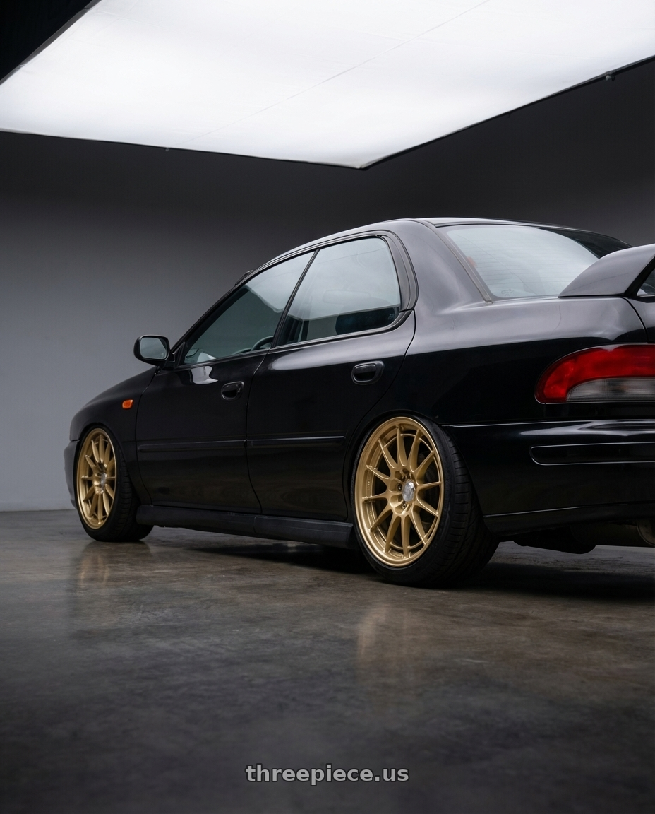 1998 Subaru Impreza GC8 with Enkei NT03+M 5x100 18x9.5+40 Gold wheels rear three quarter view slight stretch tires