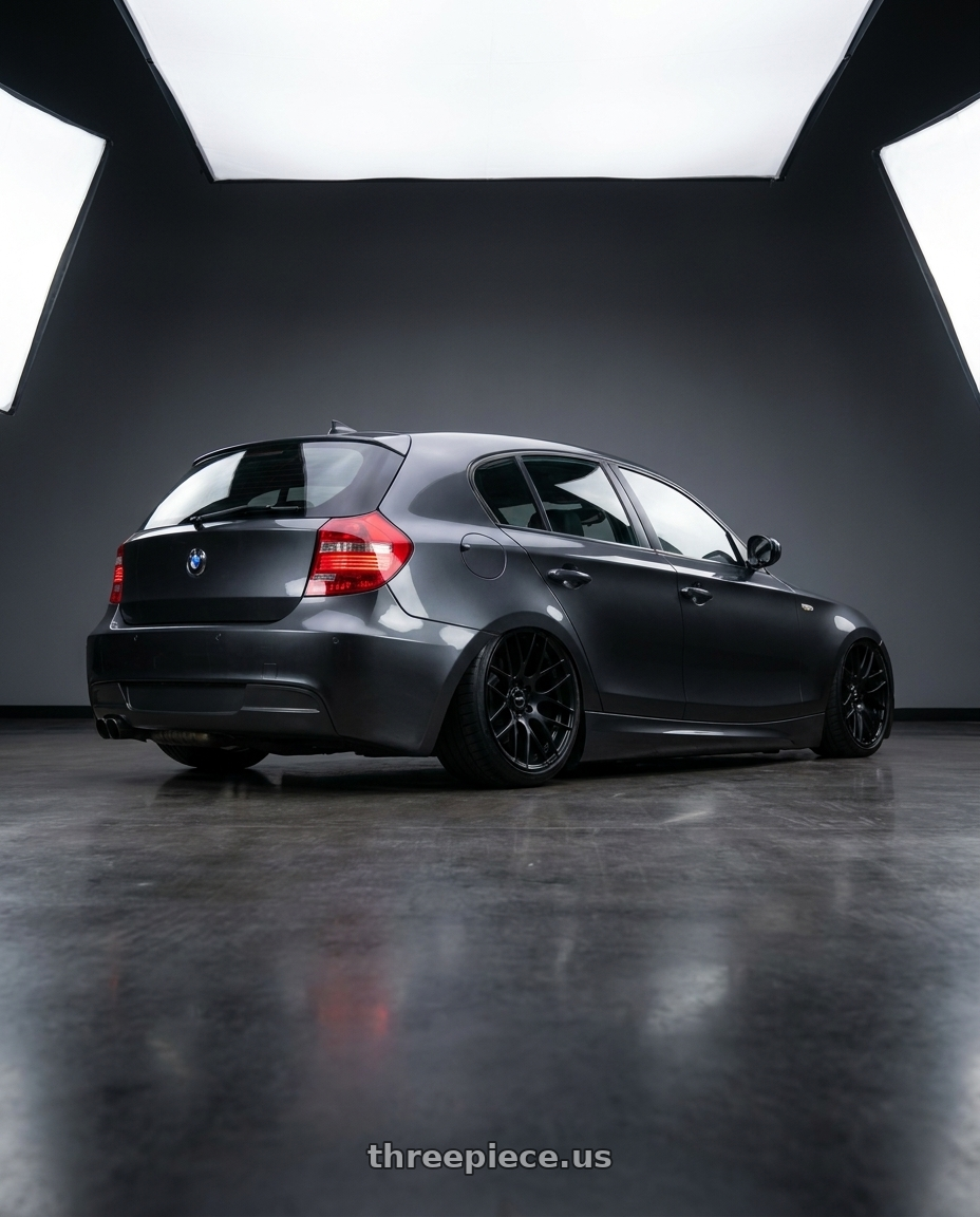 2012 BMW 1 Series E82 with Avant Garde Wheels M359 5X120 19x9 +18 Matte Black wheels rear three quarter view slight stretch tires