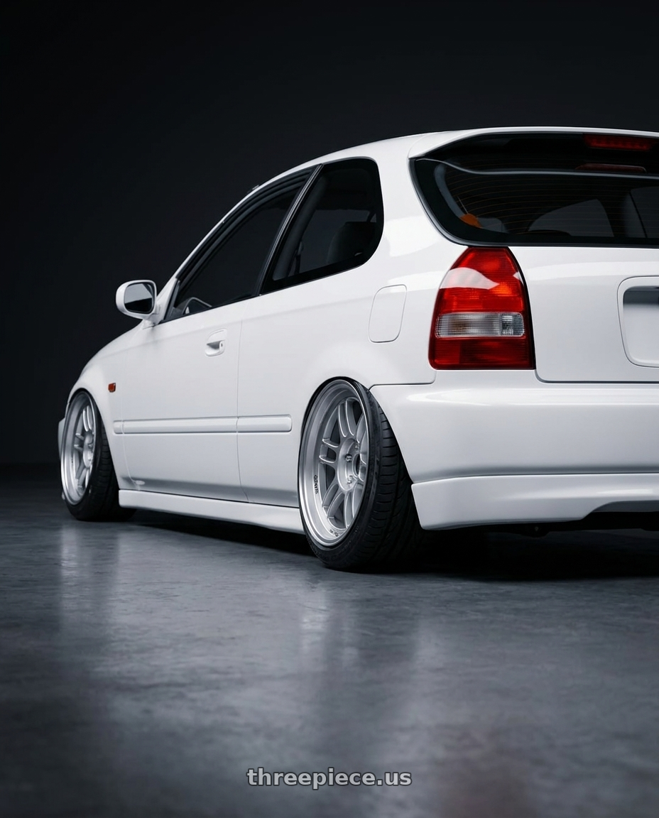 2000 Honda ek3 white with Enkei RPF1 4x100 14x7+19 Silver wheels rear three quarter view extreme stretch tires