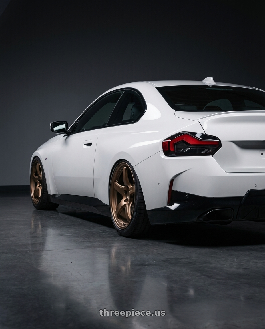 2024 BMW 2 Series G42 with Gram Lights 57CR 5x112 19x10.5+35 Bronze II wheels rear three quarter view slight stretch tires
