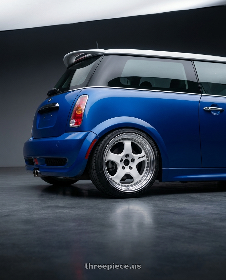 2006 mini cooper s  with Work Meister S1 3P 4x100 17x8+36 W Disk White wheels rear three quarter view square tires