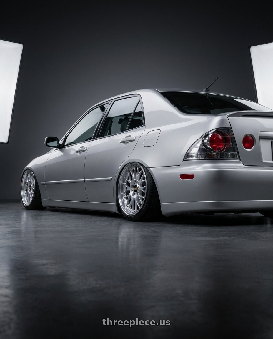 1999 Lexus is200 with BBS RS-GT 5x114.3 20x8.5+43 Diamond Silver wheels rear three quarter view slight stretch tires