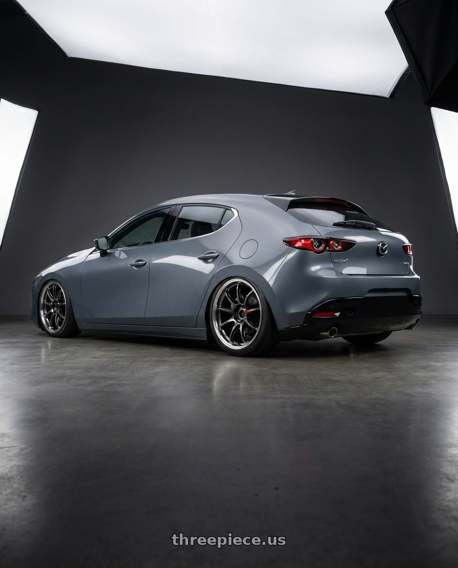 2023 mazda3 5d signature carbon packge Polymetal Grey Metallic with Work Emotion Zr10 5x100 18x7.5 +38 Glim Black Diamond Rim cut wheels rear three quarter view square tires