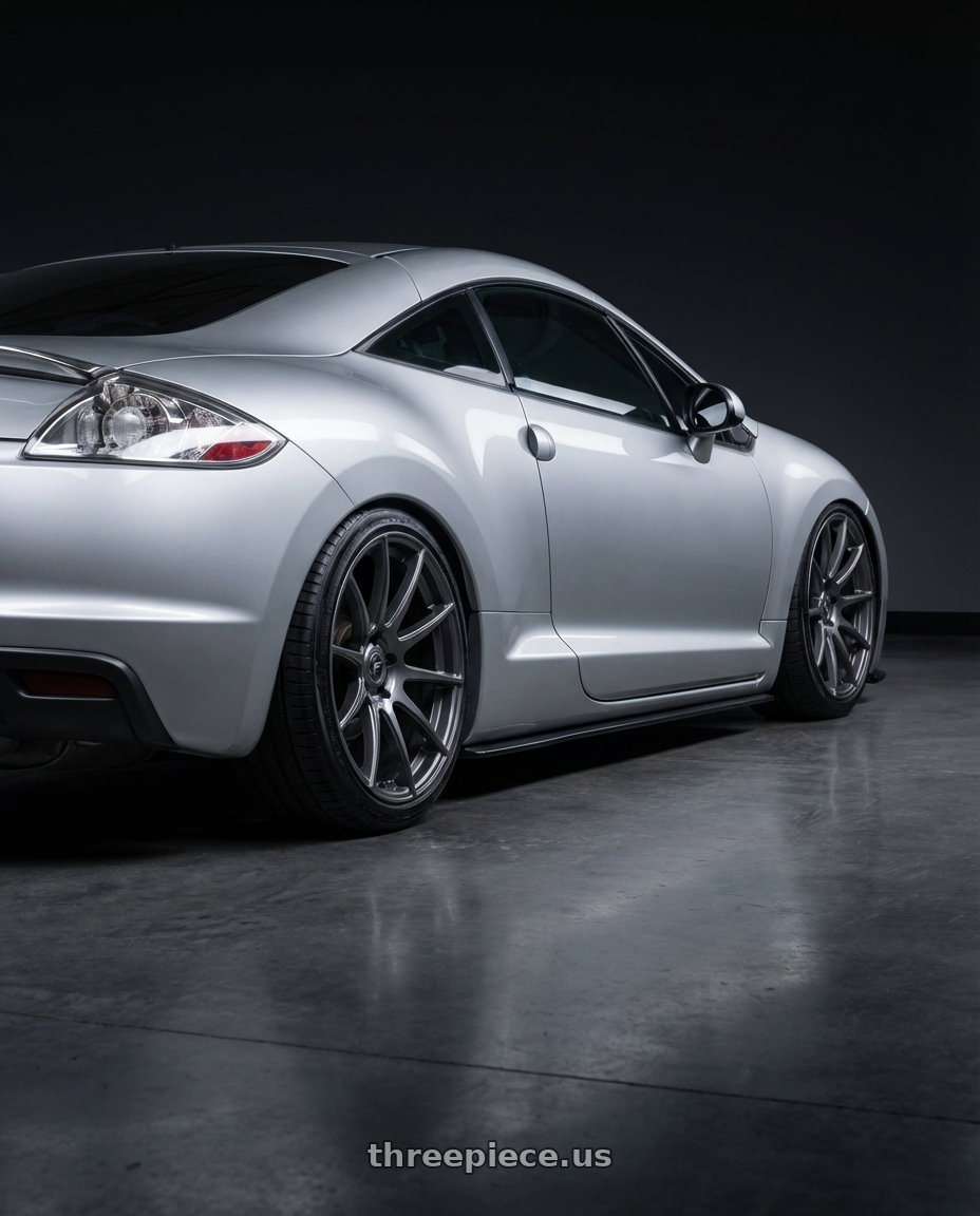 2010 Mitsubishi Eclipse with Forgestar CF10 5x114.3 19x10 +42 Gloss Anthracite wheels rear three quarter view slight stretch tires