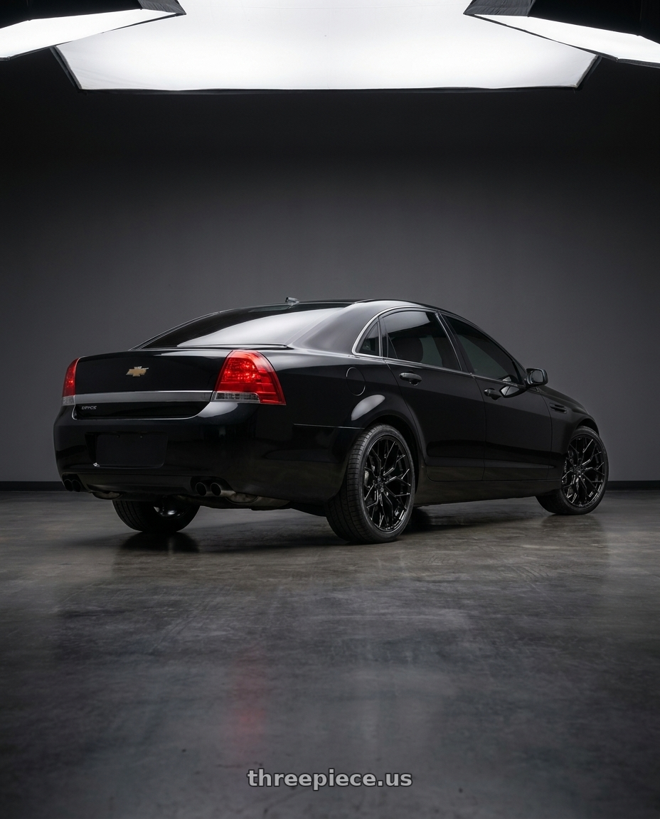 2014 Chevrolet Caprice PPV with DOLCE PERFORMANCE ARIA 5x120 20x8.5 +28 Gloss Black wheels rear three quarter view square tires