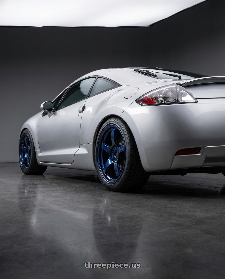 2010 Mitsubishi Eclipse with Gram Lights 57CR 5x114.3 18x9.5+12 Eternal Blue Pearl wheels rear three quarter view square tires