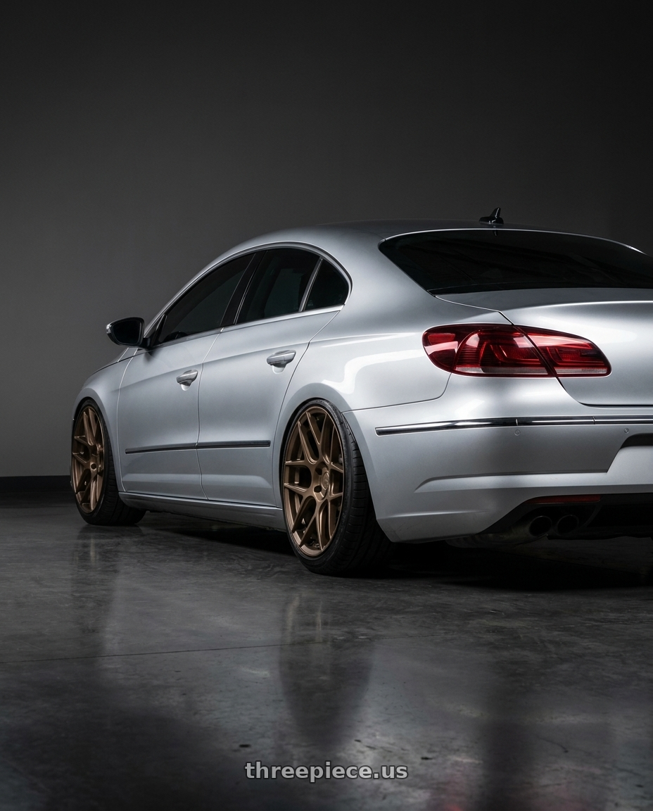 2015 Volkswagen CC with Aodhan AFF2 5x112 19x8.5+35 Matte Bronze wheels rear three quarter view slight stretch tires