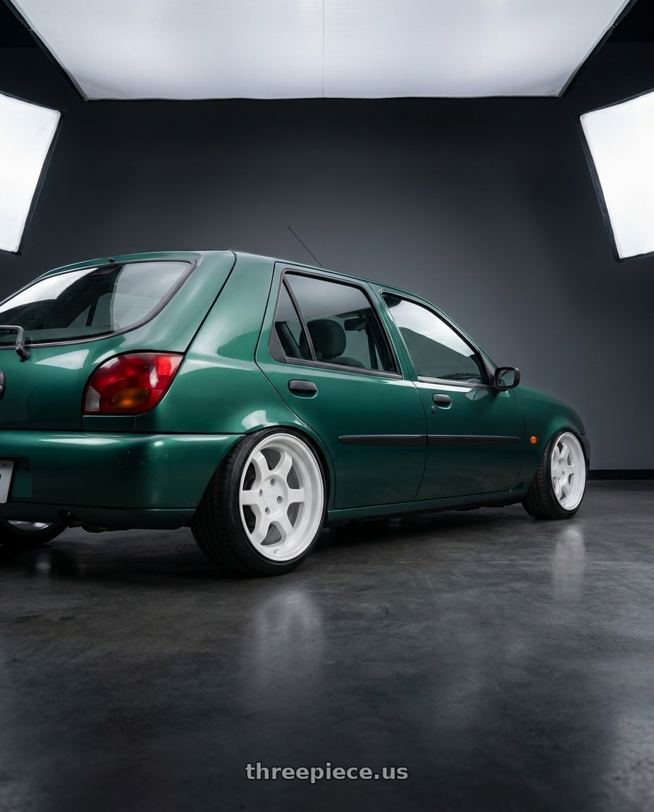 1997 Fiesta 10 with 9six9 SIX-1 Deep 4x100 15X8 +20 Competition White wheels rear three quarter view slight stretch tires