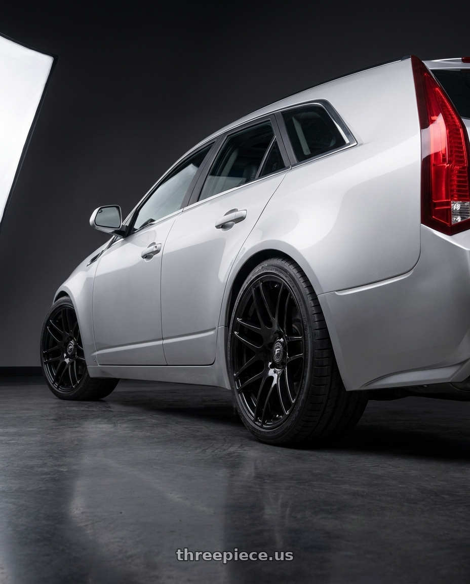 2010 Cadillac CTS with Forgestar F14 5x120 18x8.5 +35 Gloss Black wheels rear three quarter view square tires