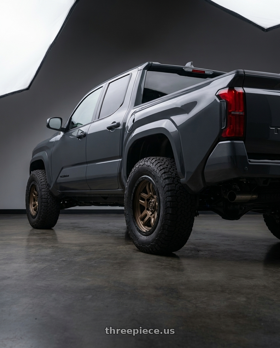 toyota tacoma 4th gen 2024 sr rwd with Fuel 1PC D702 AMMO 6X139.7 17X9 -12 MATTE BRONZE BLACK BEAD RING wheels rear three quarter view meaty tires