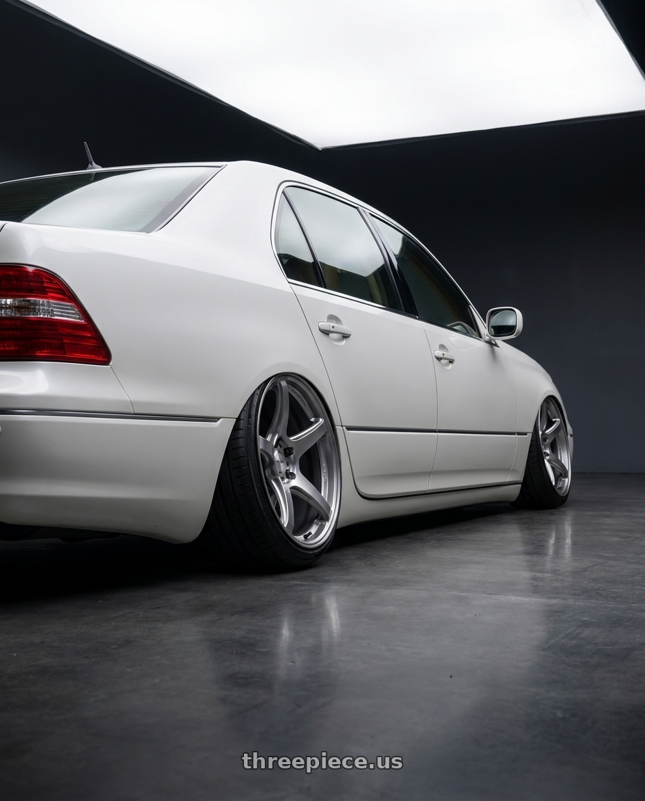 2004 lexus ls430 with Work Emotion T5r 5x114.3 19x9.5 +35 Glow Silver wheels rear three quarter view extreme stretch tires