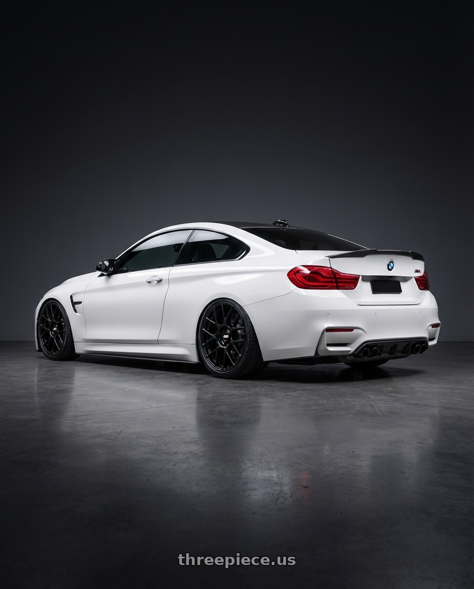 2018 BMW M4 F82 with BBS XR 5x120 19x8.5+35 Gloss Black wheels rear three quarter view slight stretch tires