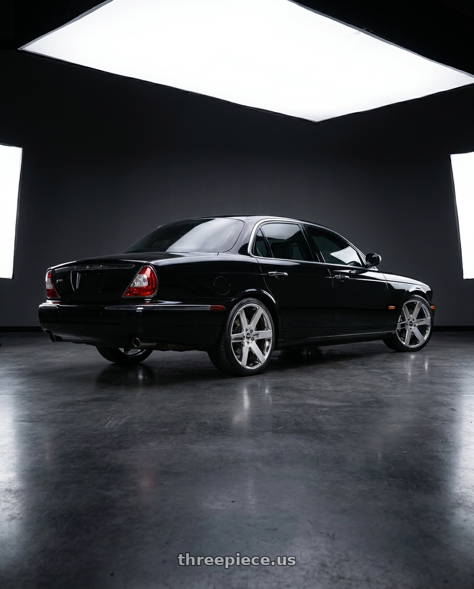 2008 Jaguar xj8 black with Strada Coda 5x112 20x8.5 +35 Chrome wheels rear three quarter view square tires