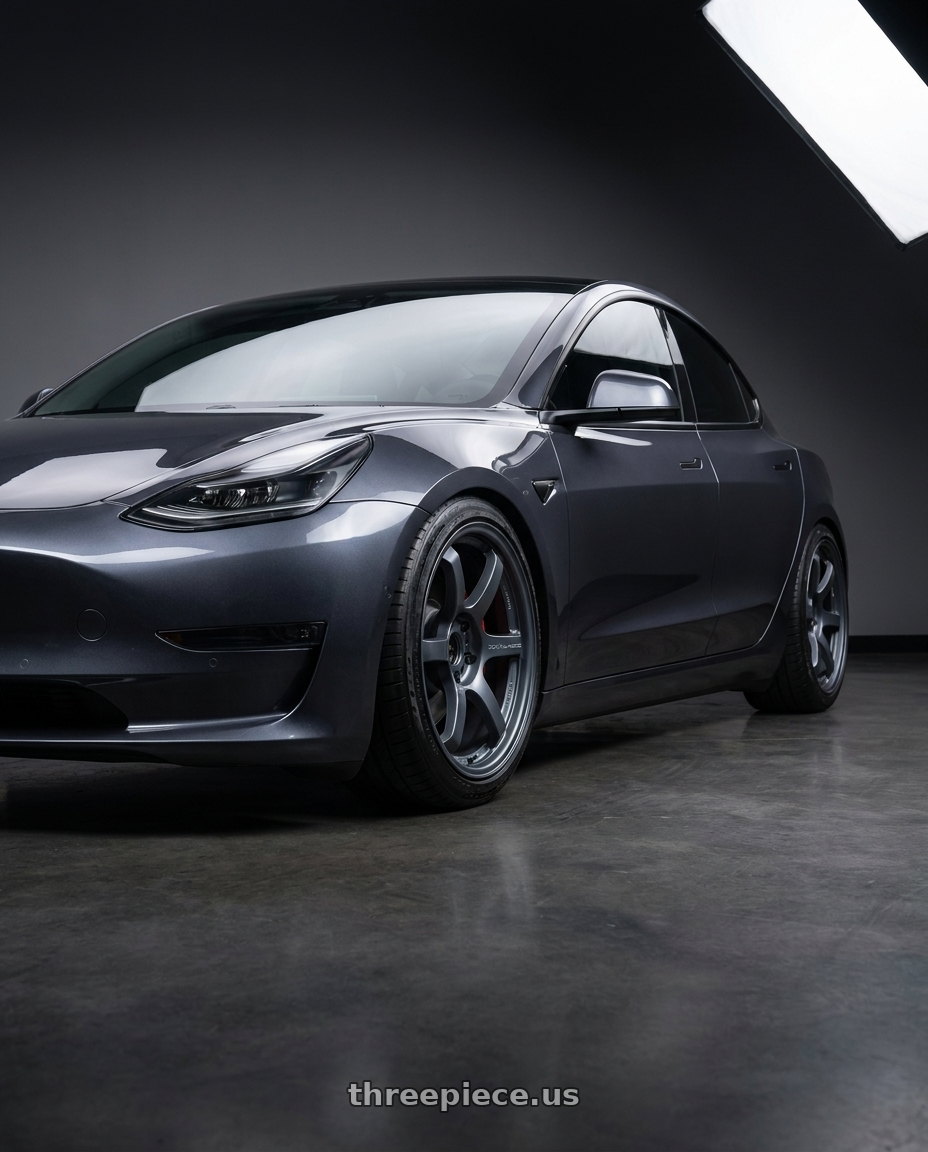 2023 Tesla Model 3 Performance with Gram Lights 57DR 5x114.3 19x9.5+25 Gunblue II wheels front three quarter view lowered stance