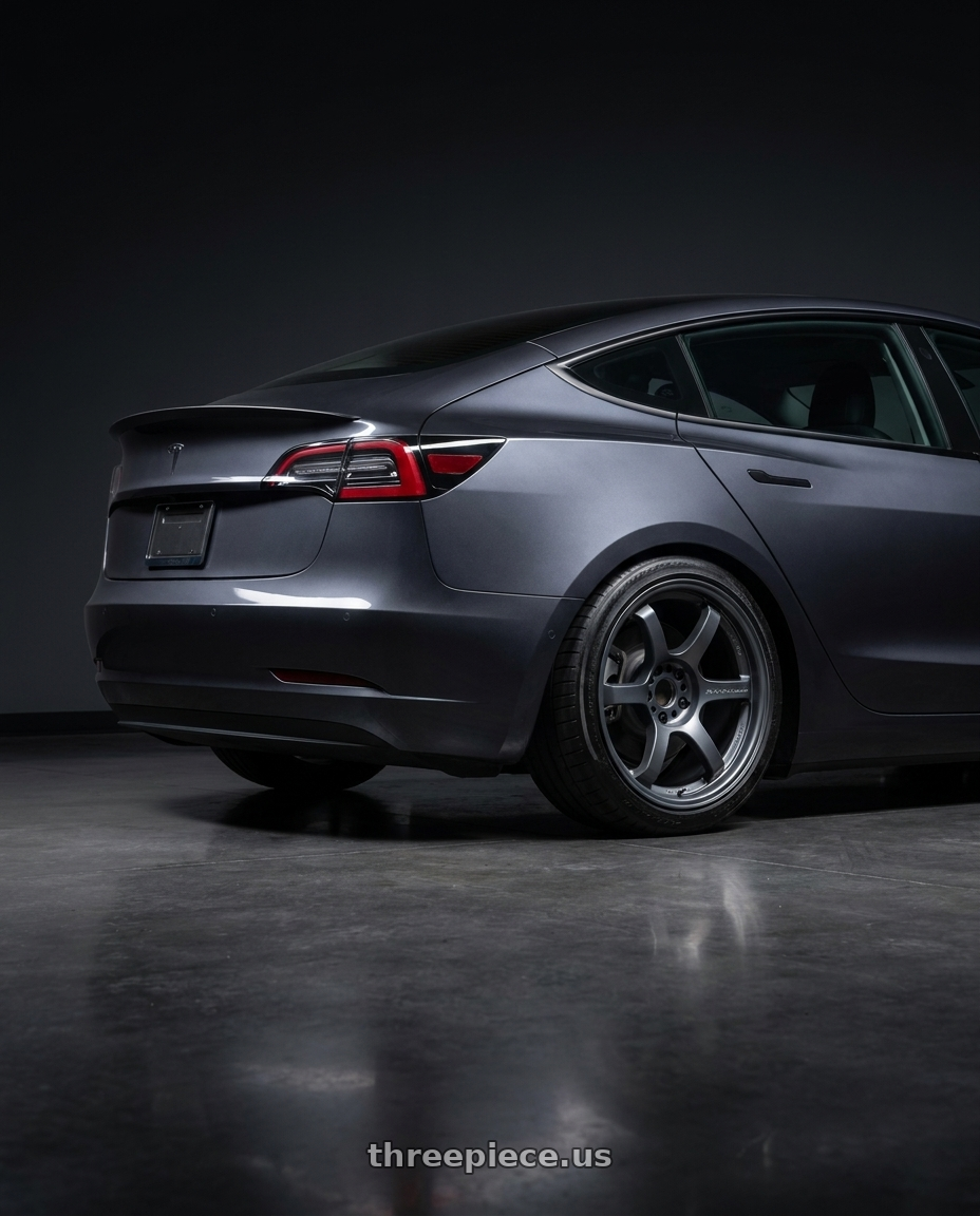 2023 Tesla Model 3 Performance with Gram Lights 57DR 5x114.3 19x9.5+25 Gunblue II wheels rear three quarter view slight stretch tires