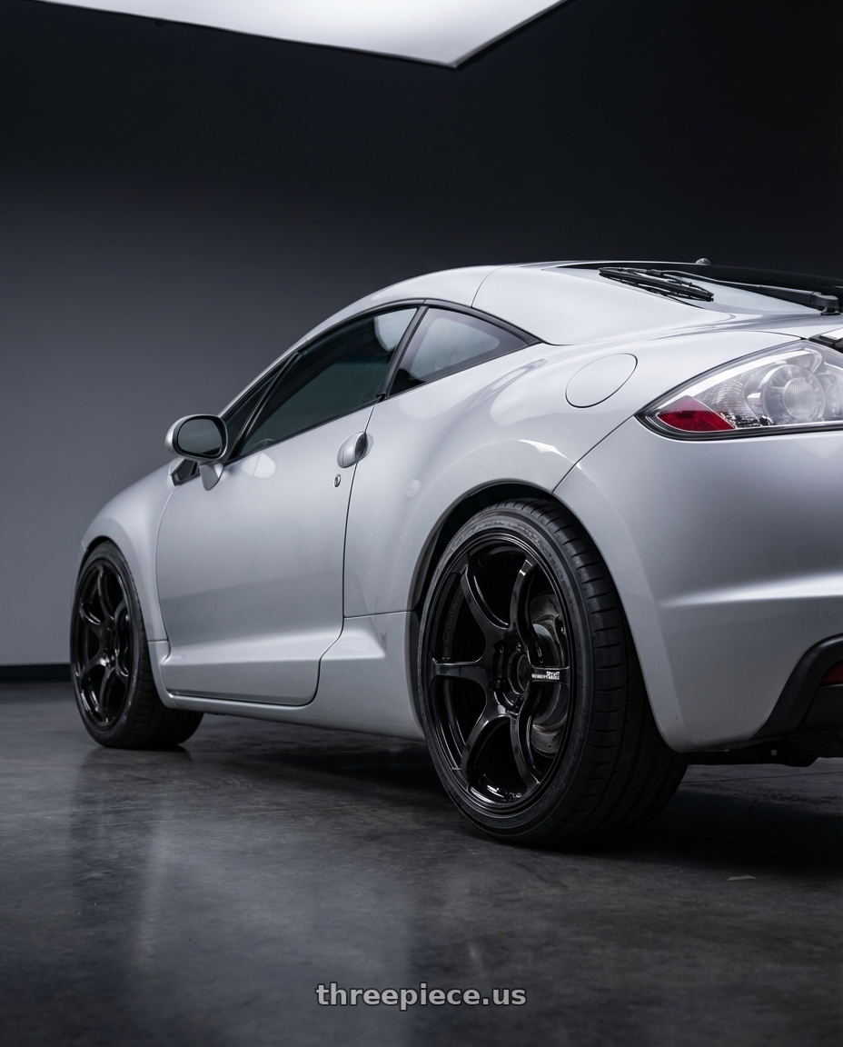 2010 Mitsubishi Eclipse with Advan RGIII 5x114.3 18x9.0+25 Gloss Black wheels rear three quarter view square tires