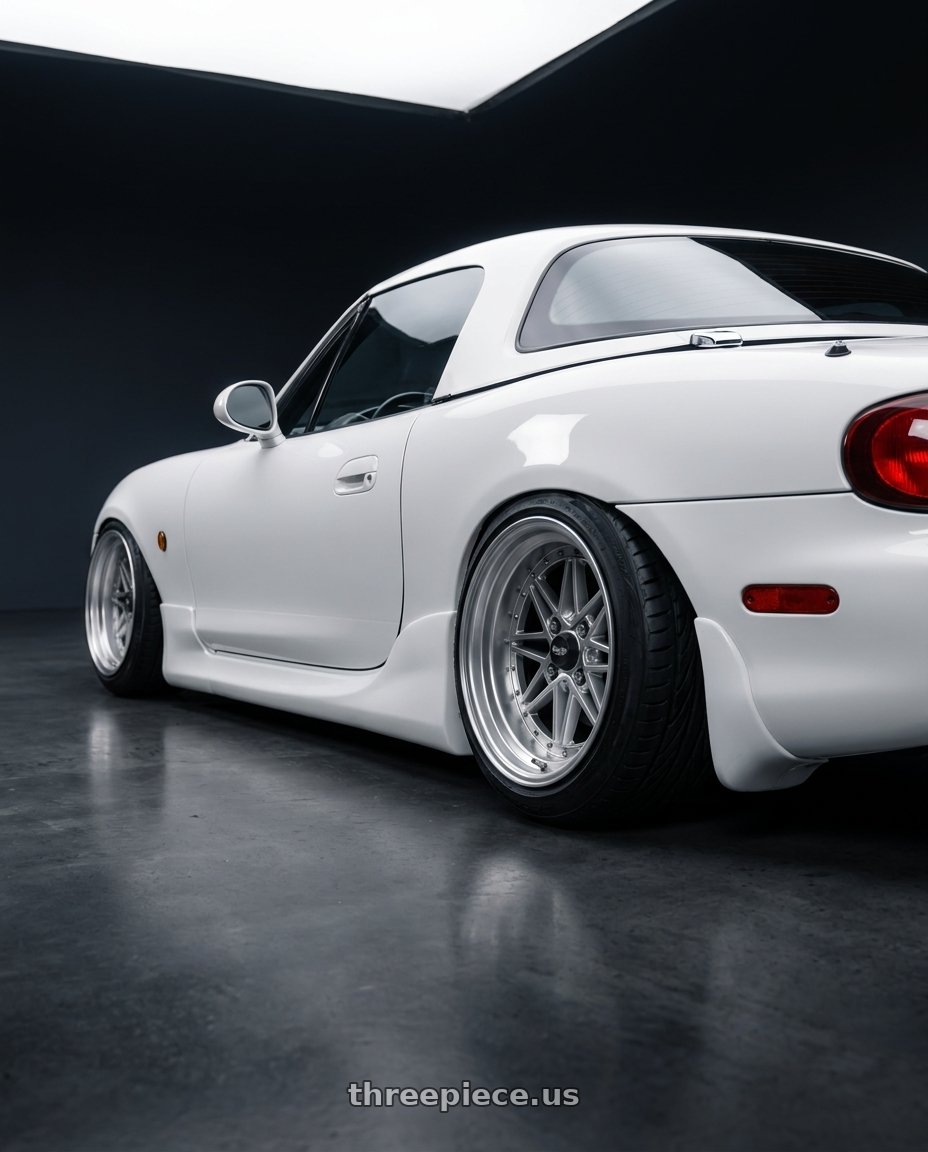 2001 Mazda miata with Work Equip 40 4x100 15x6 -3 a disk Brut Silver wheels rear three quarter view extreme stretch tires