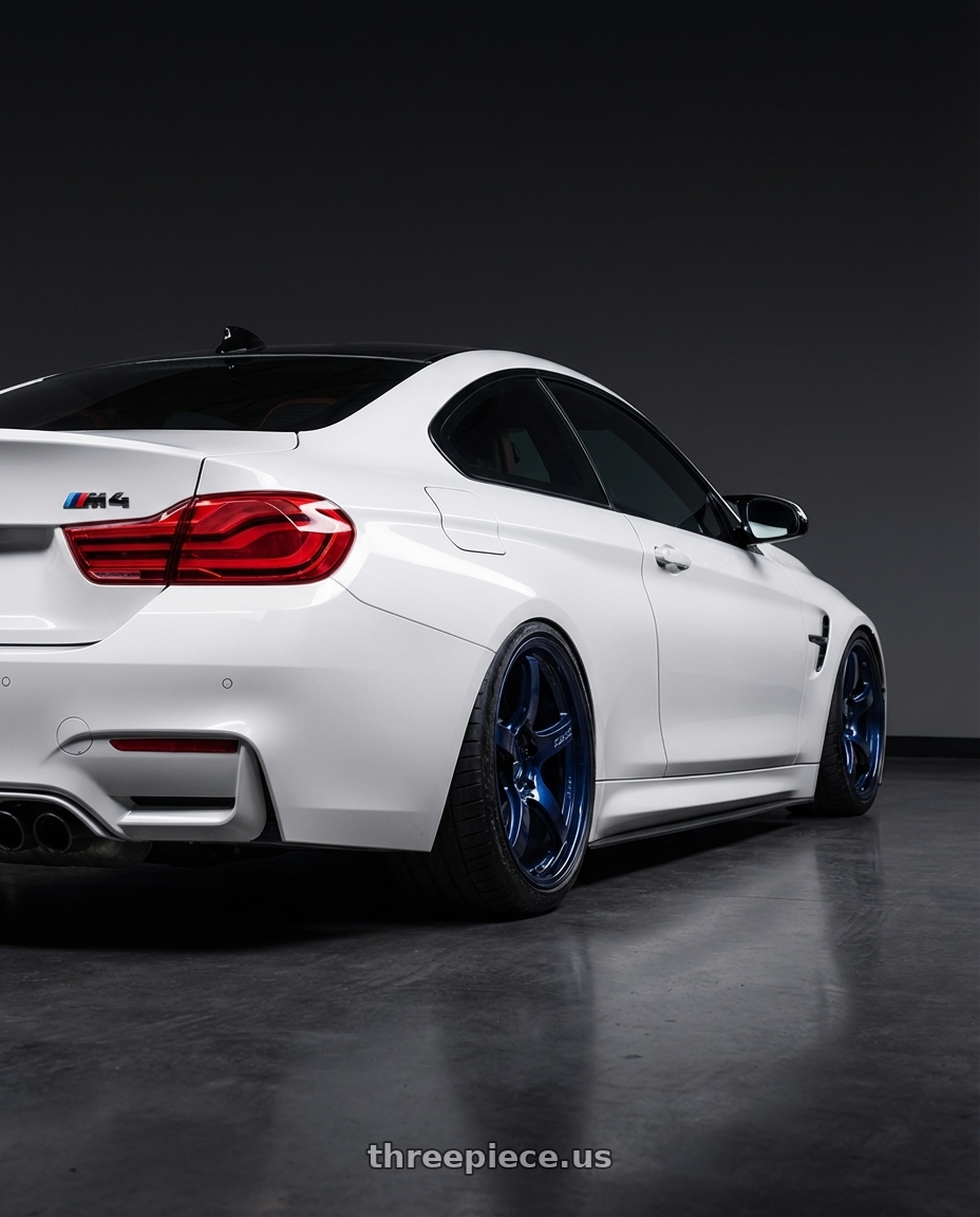 2018 BMW M4 F82 with Gram Lights 57CR 5x120 19x9.5+35 Eternal Blue Pearl wheels rear three quarter view slight stretch tires