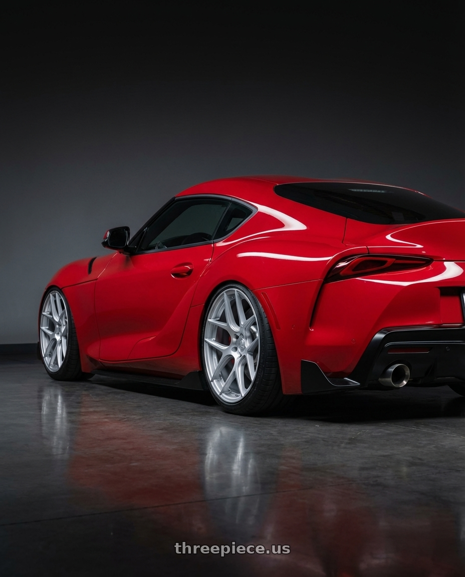 2023 Toyota GR Supra with Aodhan AFF2 5x112 19x8.5+35 Gloss Silver Machined Face wheels rear three quarter view slight stretch tires