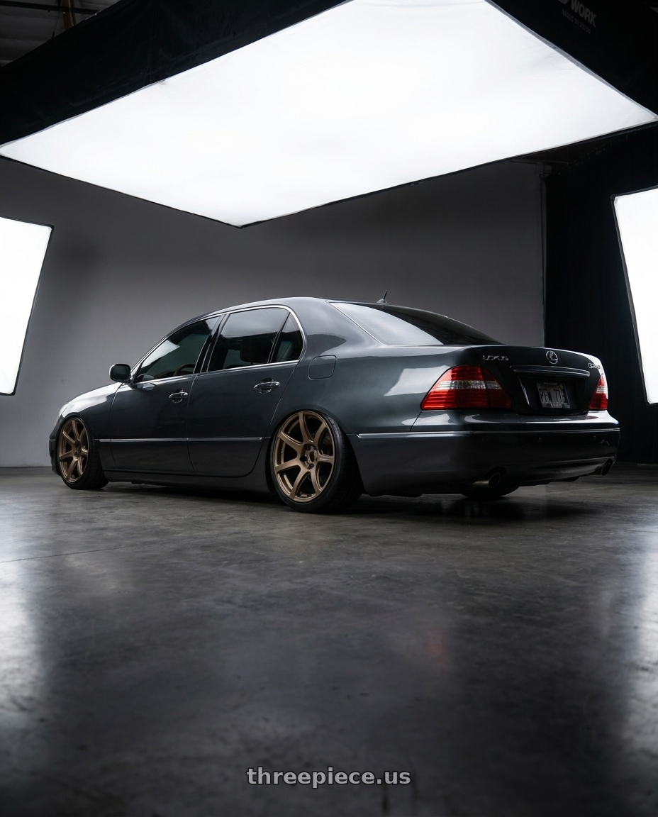 2006 Lexus LS430 with Work Emotion T7r 5x114.3 19x9.5 +38 Matte Bronze wheels rear three quarter view slight stretch tires