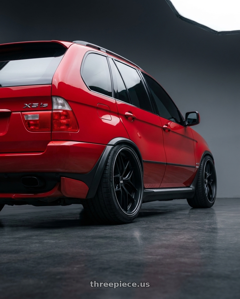 2005 BMW X5 4 8is with BBS CC-R 5x114.3 20x10.5+25 Satin Black wheels rear three quarter view extreme stretch tires