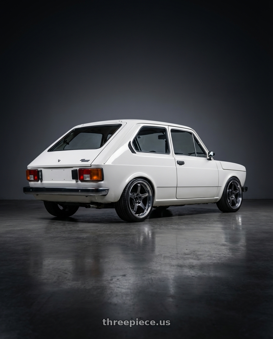 1979 fiat 147 with Advan Racing GT BEYOND 4x100 17x7.5 +32 MACHINING & HYPER PLATINUM BLACK wheels rear three quarter view slight stretch tires