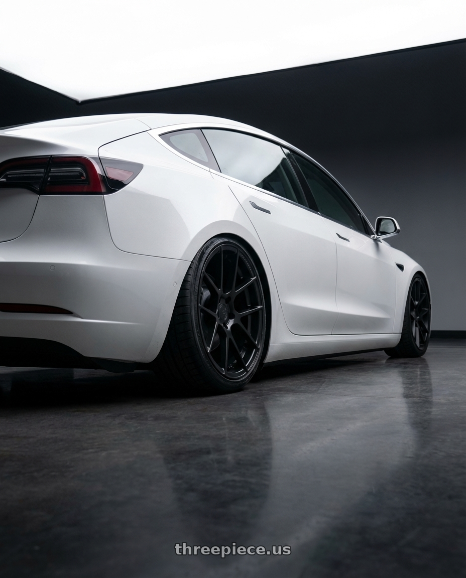 2023 Tesla Model 3 with Avant Garde Wheels M510 5X114.3 19x9.5 +40 Matte Black wheels rear three quarter view slight stretch tires