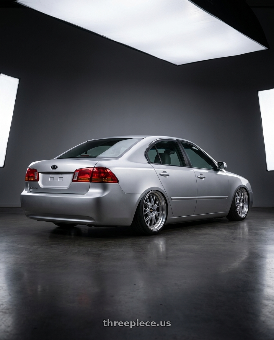 2006 Kia Magentis Silver with BBS LM-R 5x114.3 19x8.5+43 Diamond Silver wheels rear three quarter view square tires