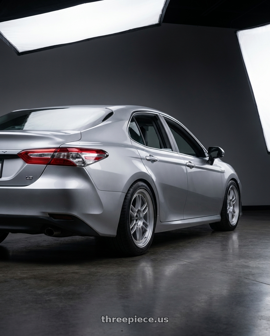 2021 Toyota Camry Hybrid LE with Enkei RPF1 5x114.3 18x9+35 Silver wheels rear three quarter view square tires