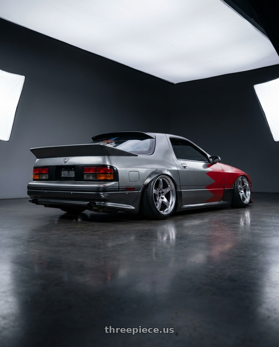 1987 Mazda RX FC grey with Gram Lights 57CR 5x114.3 17x9 +38 GRACE SILVER wheels rear three quarter view slight stretch tires