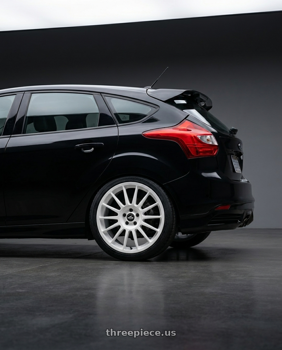 2013 focus st black with fifteen52 PODIUM 5x100 / 5x114.3 17x7.5 +40 RALLY WHITE (GLOSS WHITE) wheels rear three quarter view square tires