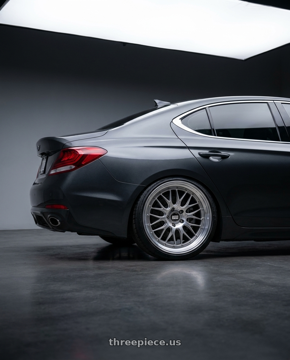 2019 Genesis G70 with BBS FI-R Evo CL 21x12.0+70 Platinum Silver wheels rear three quarter view slight stretch tires