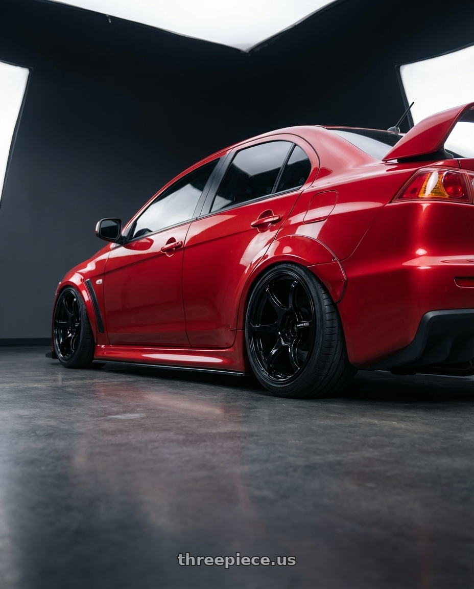 2012 Mitsubishi Lancer Evo X with Advan RGIII 5x114.3 18x8.0+37 Gloss Black wheels rear three quarter view slight stretch tires