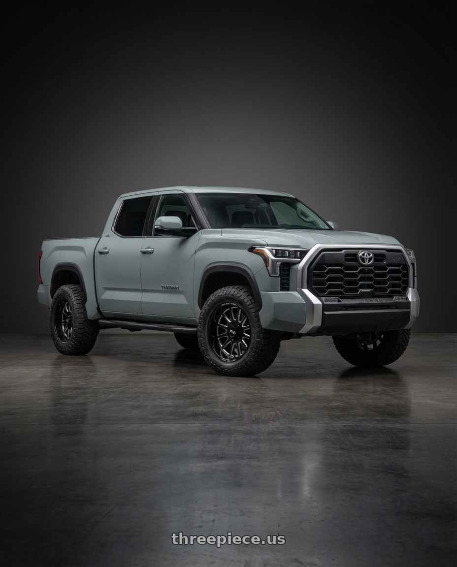 2024 Toyota Tundra with Moto Metal MO401 6X139.7 20X10 -24 GLOSS BLACK MILLED wheels front three quarter view stock stance