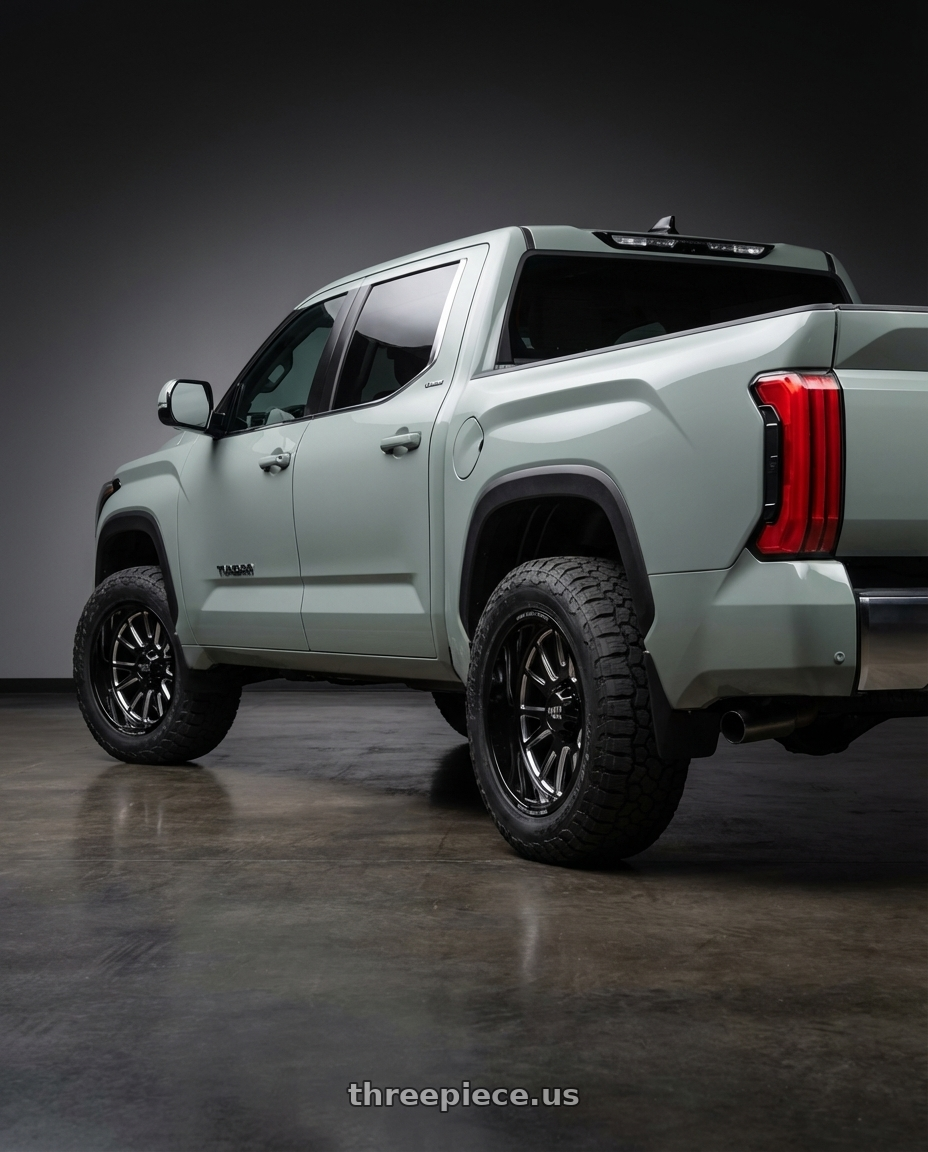 2024 Toyota Tundra with Moto Metal MO401 6X139.7 20X10 -24 GLOSS BLACK MILLED wheels rear three quarter view meaty tires