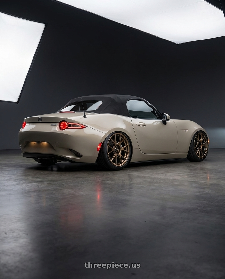 2021 Mazda MX-5 Miata ND with Konig Ampliform 5x114.3 17x8+40 Gloss Bronze wheels rear three quarter view slight stretch tires