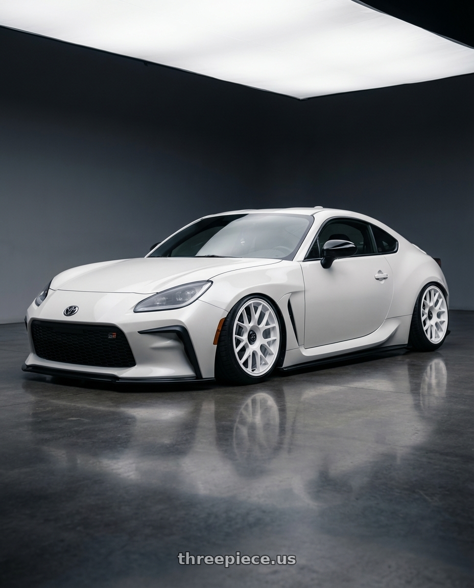 2016 Scion FR-S with fifteen52 APEX 5x100 / 5x114.3 18x8.5 +35 RALLY WHITE (GLOSS WHITE) wheels front three quarter view stanced stance