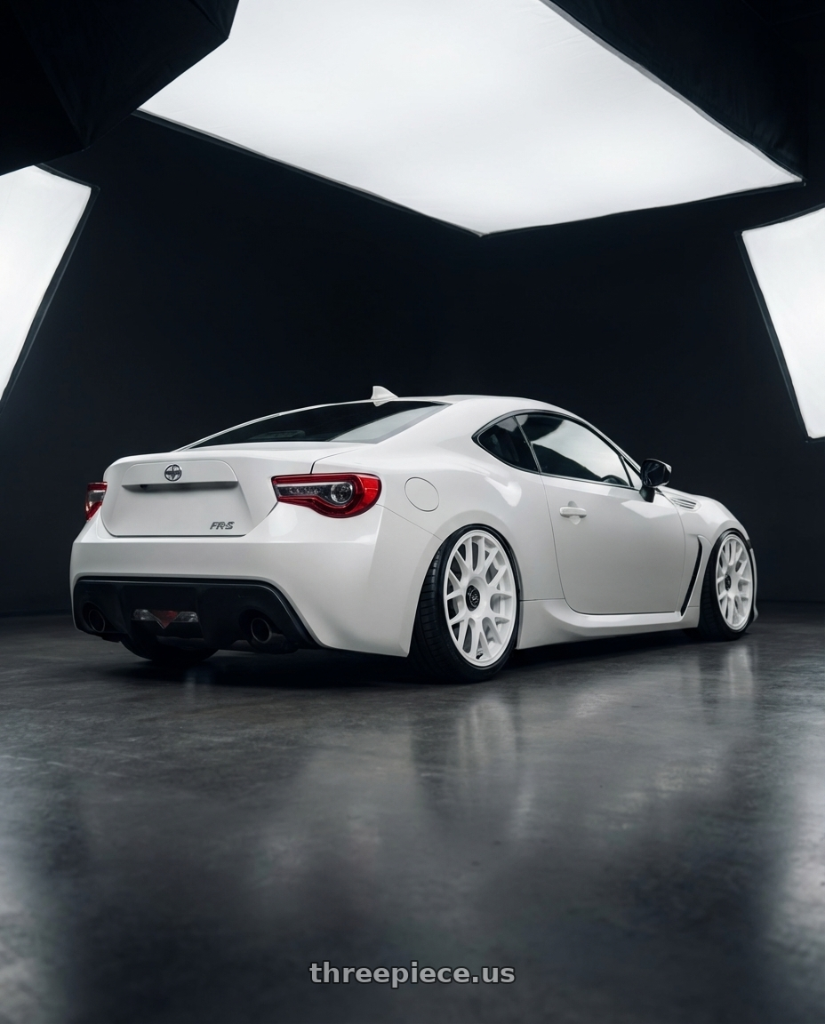 2016 Scion FR-S with fifteen52 APEX 5x100 / 5x114.3 18x8.5 +35 RALLY WHITE (GLOSS WHITE) wheels rear three quarter view slight stretch tires