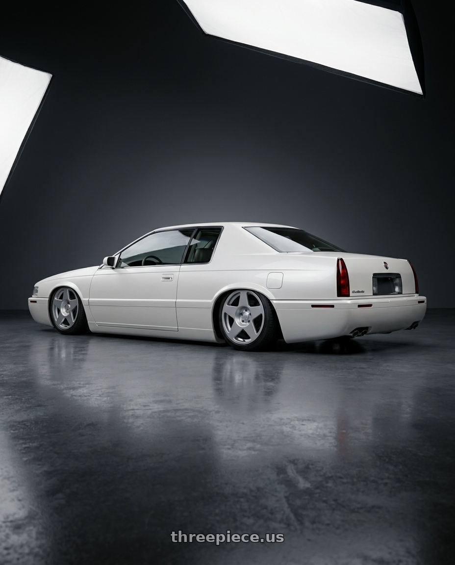 1999 Cadillac Eldorado  with fifteen52 Tarmac 4x108 17X7.5 +42 SPEED SILVER (GLOSS SILVER) wheels rear three quarter view slight stretch tires