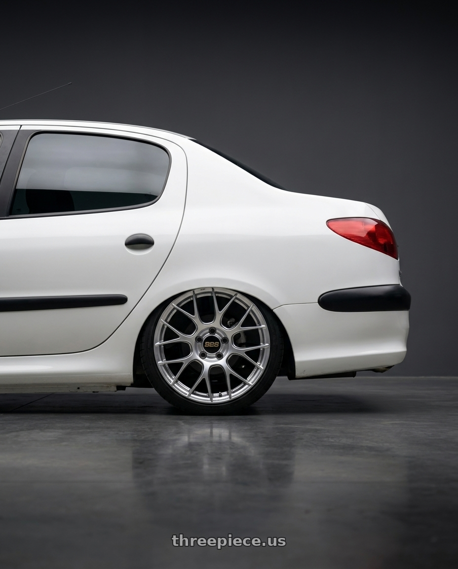 2011 Peugeot 206 SD with BBS RE-V7 5x112 18x8.5 +25 Diamond Silver wheels rear three quarter view square tires