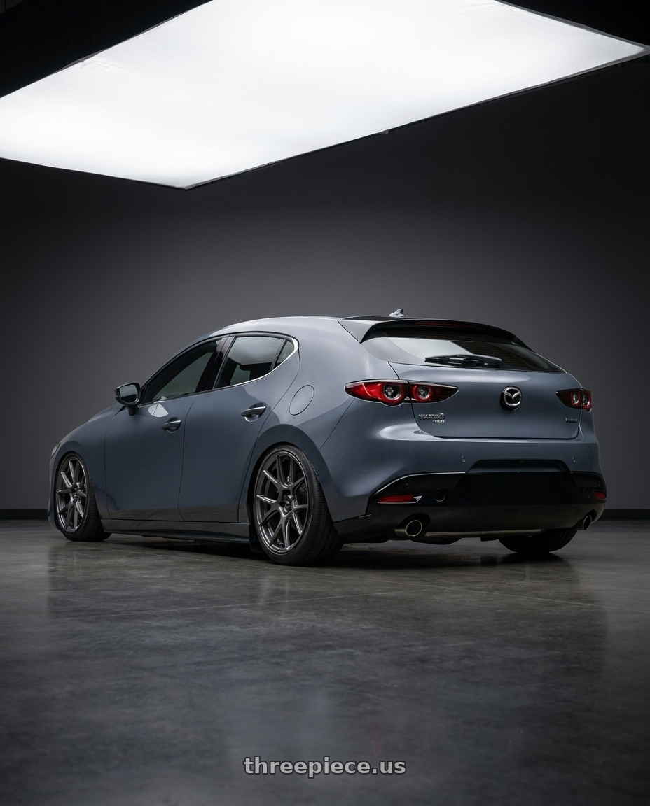 2023 Mazda Mazda3 Turbo with Konig Ampliform 5x114.3 18x9.5+35 Dark Metallic Graphite wheels rear three quarter view slight stretch tires