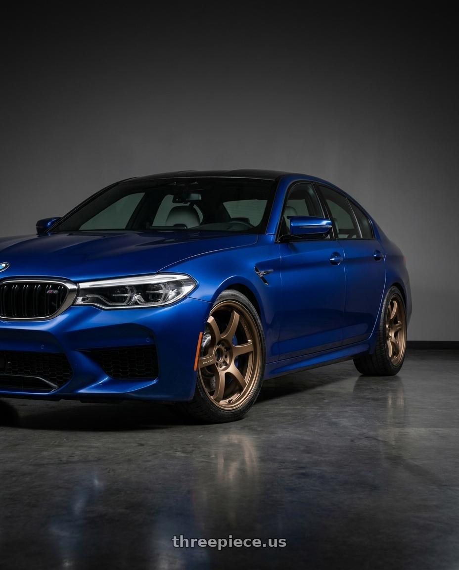 2018 BMW M5 with Gram Lights 57DR 5x112 19x9.5 +25 BRONZE 2 wheels front three quarter view lowered stance