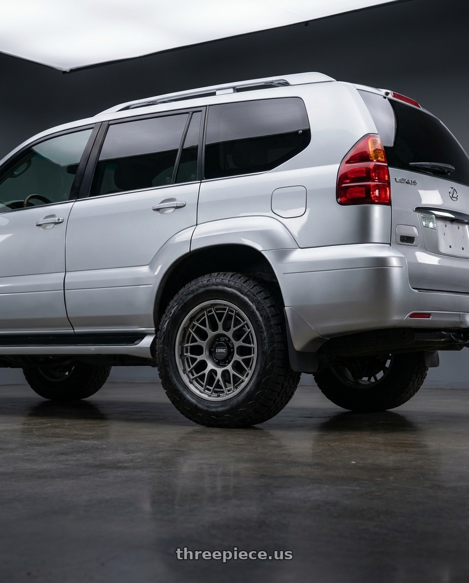 2006 Lexus GX470 with KMC KM722 TECHNIC 6X139.7 20X9 +18 ANTHRACITE wheels rear three quarter view meaty tires